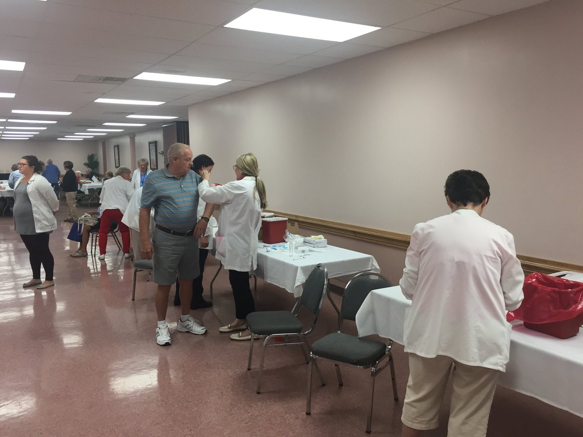 ETNbruce's tweet photo. LifeWorks Erie nurses give flu shots at the agency’s annual Expo and Vaccination Kickoff Clinic on Thursday at the Shrine Club. #eriehealth https://t.co/RHopH4eAuo