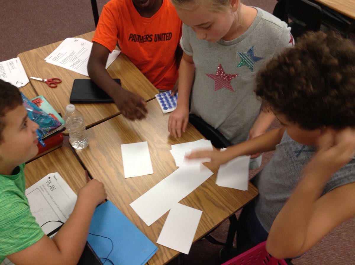 Using the design process to build towers using only 20 dot stickers and 12 index cards!