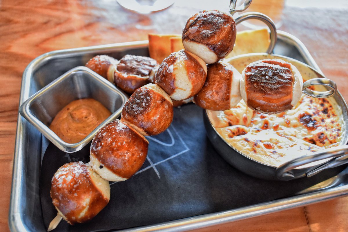 This creation by @kre8twistedeats is quite the spin on the typical homemade pretzel and beer cheese dish. The “he’s having beer cheese” is a skewered handful of salt crusted pretzel bites served with Wooden Robot’s rotating IPA beer cheese and pale ale mustard. <a href="/WoodenRobotAle/">Wooden Robot Brewery</a>