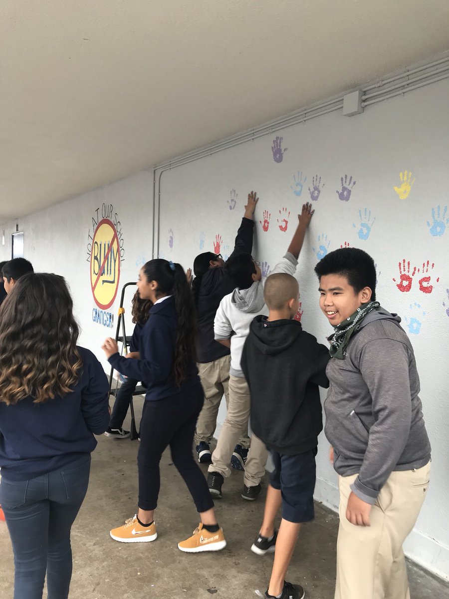 SeilerBiology's tweet photo. #grangergriffins pledging to stop bullying on our campus with their handprints on our campus wall 💜💙💛❤️ https://t.co/v2FMwZSzbp