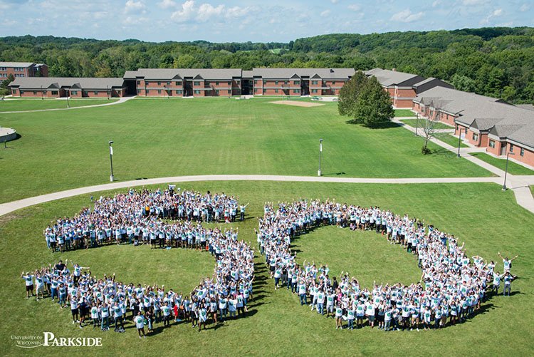uwparkside's tweet photo. More than 1,000 new UW-Parkside students gathered outside Pike River Suites ... and in the shape of a 50! Happy 50 Years UWP!! Great photo by campus photographer Alyssa Nepper @ChancellorFord @Journaltimes @Kenosha_News @UWSystem #uwp50 https://t.co/QXpZR9SjKy