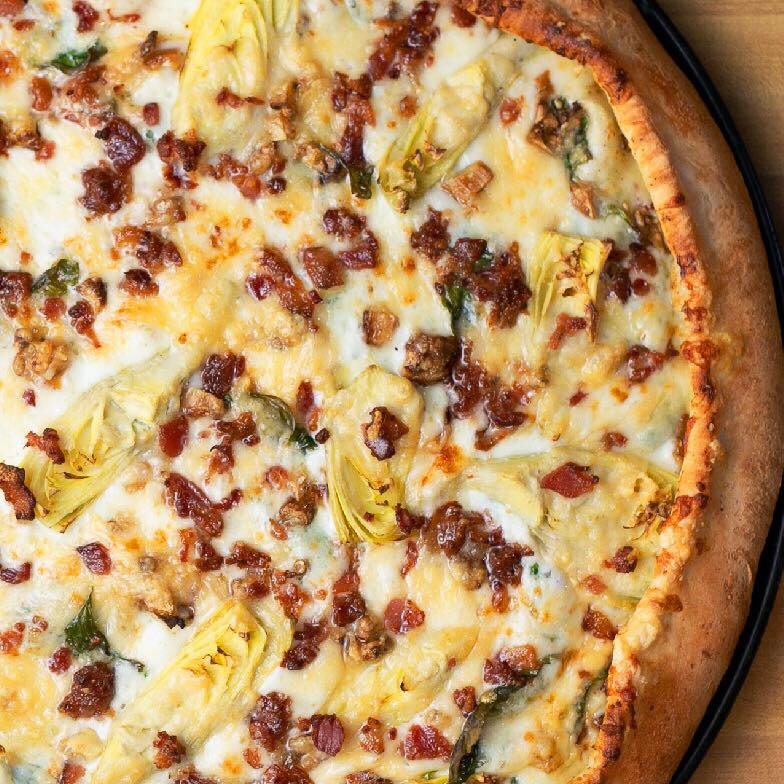 SBmenus's tweet photo. Meet the latest and greatest creation from Woodstock's Pizza, “All ‘Choked Up” 🤤 Creamy garlic sauce, spinach, mozzarella, roasted garlic, artichoke hearts, all smothered in shaved parmesan and loads of bacon 🥓 Order now: https://t.co/bW66khqkNm https://t.co/889ALG1jGl