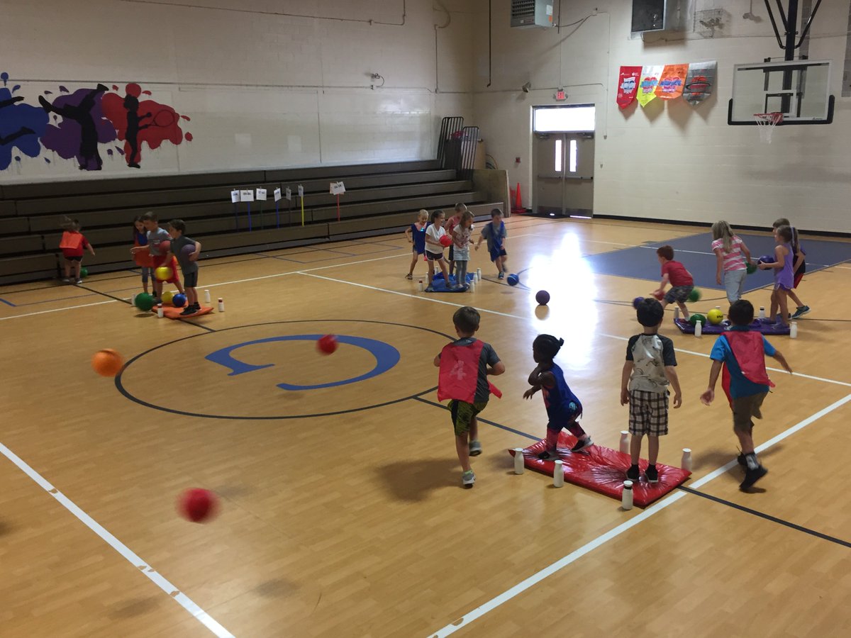 emilyrichPE's tweet photo. First grade Ss working on underhand toss and roll while playing Battle Ship. #ATribeBegins https://t.co/XN4pE9sSO1