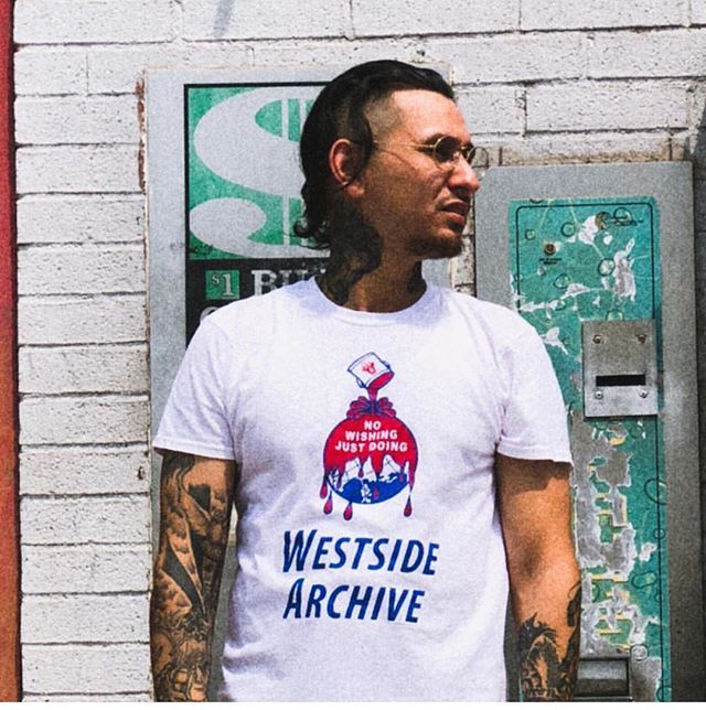 WestSideArchive's tweet photo. @twothreereed Throwing a Pose, with a dope tee. #westsidearchive #boldwillhold #tats #tattoo #vatoslocos #motivation #nowishingjustdoing https://t.co/Q8IYQYc2rN https://t.co/NHKtUzb5MS