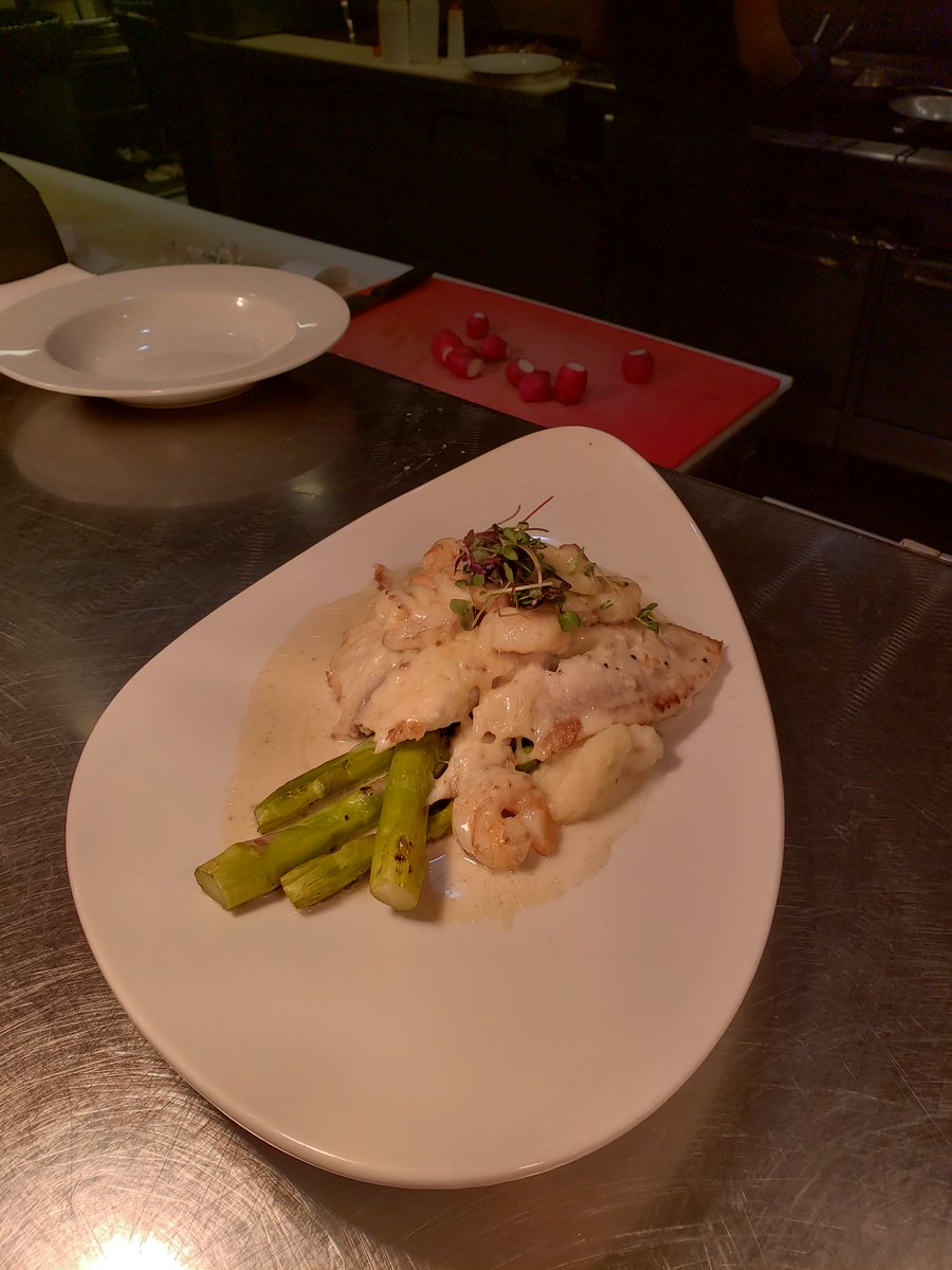 Our special tonight is a pan seared tilapia topped with alfredo baby shrimp with mashed potatoes and asparagus as the sides for $25.00
