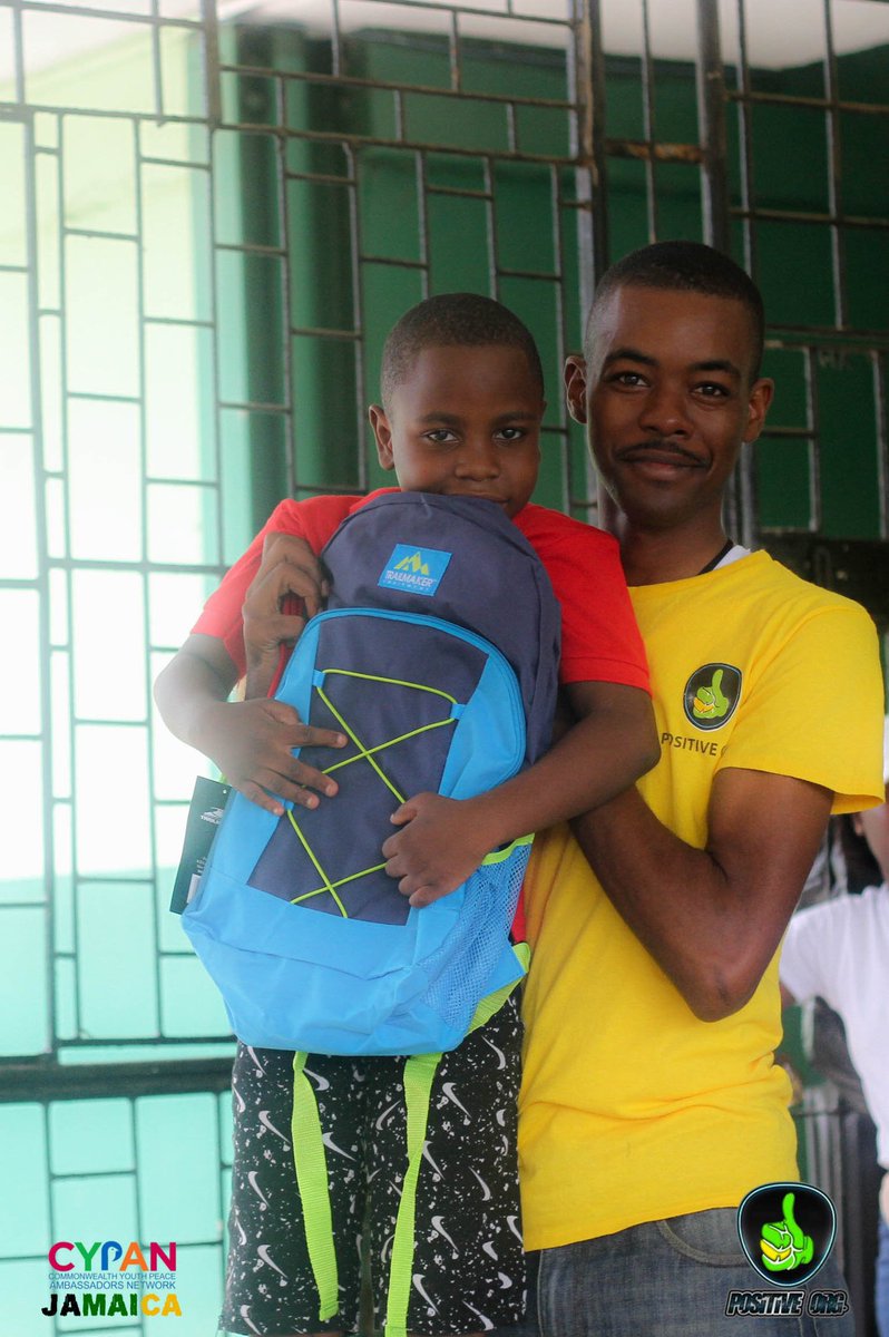 PositiveOrgJA's tweet photo. Throwback to Tivoli Gardens Youth Club book drive. Our Director and @mns_jamaica and @JamaicaConstab Constable Garcia presents back to school items to a few members. 😀🇯🇲
.
.
#YouthsInspiringPositiveChange #CYPANJamaica https://t.co/z0llhI2RMr