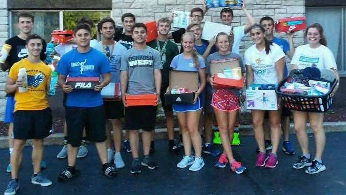 OshkoshWestHigh's tweet photo. Our cross country team had a successful hygiene drive! Thanks to all who donated items. Pictured here: the seniors deliver it to the shelter tonight after practice. #wayofthewildcat #BuildingCommunityThroughEducation https://t.co/2jCfh8iDRO