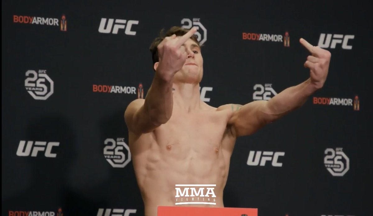 MMAHistoryToday's tweet photo. Darren Till weighs in at 169, then flips the birds at the people that doubted him. https://t.co/t1qPipsY8z