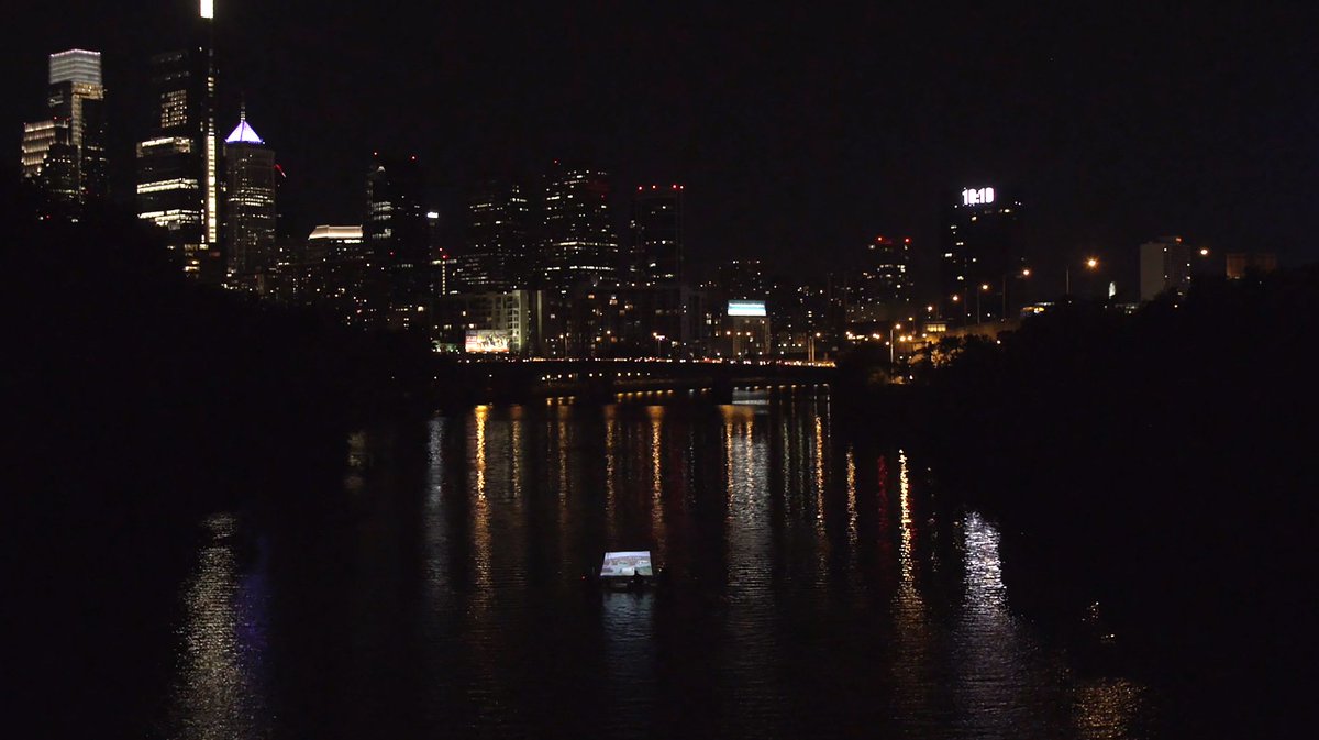 Penn's tweet photo. A floating art installation brings Schuylkill River history to life. Projected animations, hand-drawn by @PPEHLab artist-in-residence Jacob Rivkin, reflect layered narratives about the waterway. https://t.co/GY9HJqA0gw https://t.co/n8qAcoz6nQ