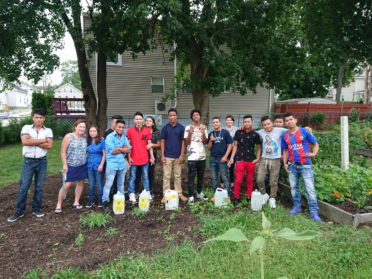 Mrs. Valentines Science class doing hands on learning at the Central Falls Community Garden.