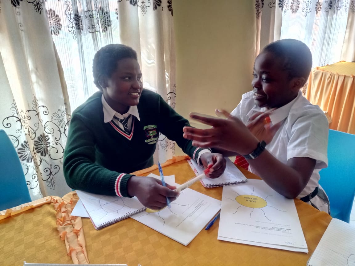 AsanteAfrica's tweet photo. FIELD DAY FRIDAY! The team visited Maralal School in Kenya this week. Here are two girls taking part in one of the sessions, focused on dream mapping and preparing for the future. #backtoschool #theyarethenext #leadership #dreammapping https://t.co/bKbz7w7zc6