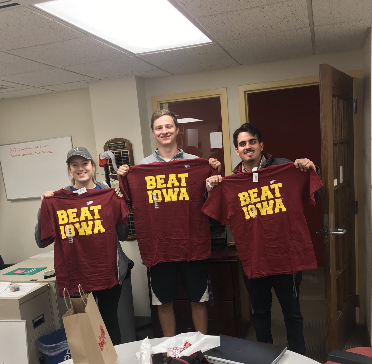 JJMovingForward's tweet photo. #CyDayFriday is here!!!! Don’t mind us sporting these $5 #BeatIowa shirts available today @isubookstore 😎 https://t.co/3HHgxVMV8d