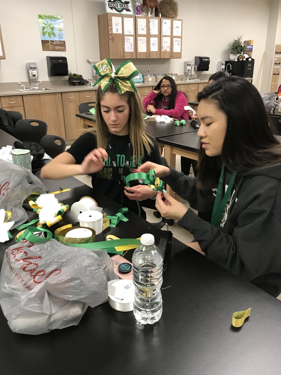 Girls working hard in floral design on their mums!