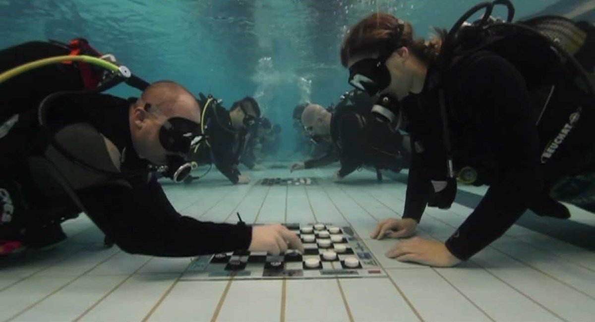 EstonianWorld's tweet photo. A hundred #facts about #Estonia: #61. The world’s first #underwater #draughts tournament was held in 2011 in #Valtu, near the #Estonian town of #Rapla. The event was attended by 52 Estonian #divers and made it into the #GuinnessWorldRecords. https://t.co/QP8jz5bNcN #Estonia100 https://t.co/mYbbQbZWgm