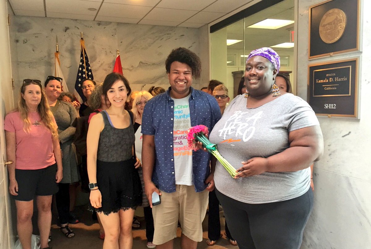 Center for Popular Democracy activists with flowers at Senator Kamala Harris’ office