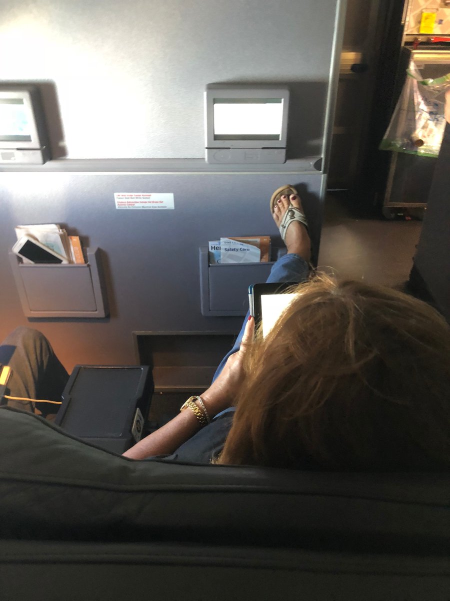 This wonderful lady is actually pushing on the wall to try and force my laptop closed.  I asked her nicely not to push back so far and she said 'I paid for this seat and can recline as far as I want.'  #passengershaming #noclass @passengershame