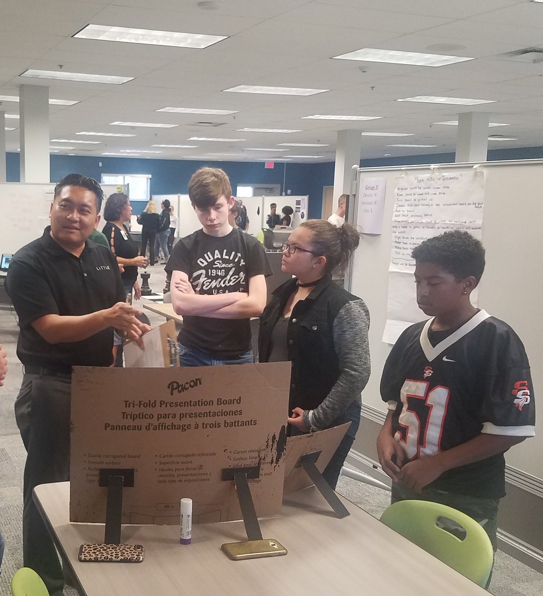 PSIHighSchool's tweet photo. Ryan, Paola & Elijah listen to Mr. Mom as he gives valuable feedback on their project #CreatingCreativeSpaces #RethinkHighSchool https://t.co/cEOD8ZPC7O