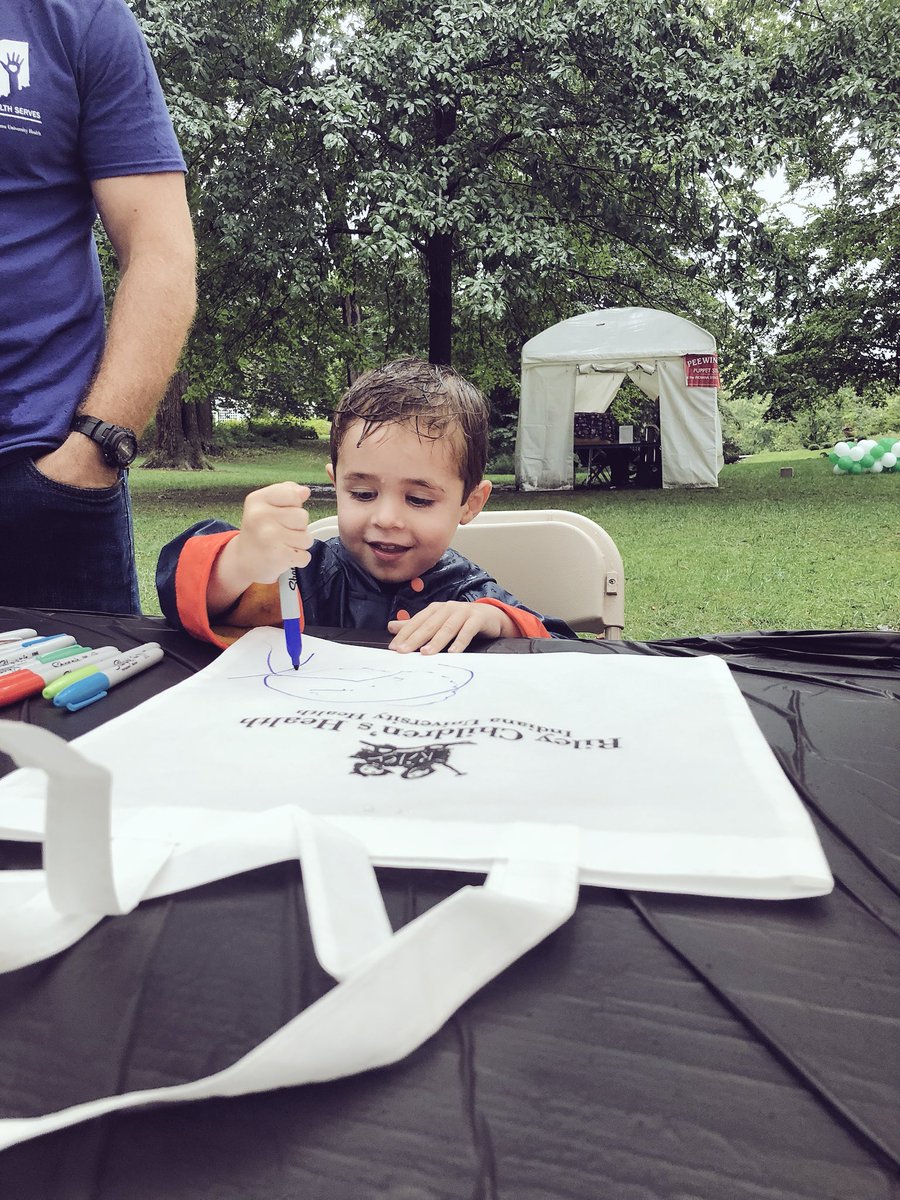 RileyArtTherapy's tweet photo. Rain or shine at @PenrodArtsFair representing @RileyChildrens And #ArtTherapy We may be damp (soaked) but how can you not smile hanging out with a face like that?! https://t.co/v4DioqKuVZ