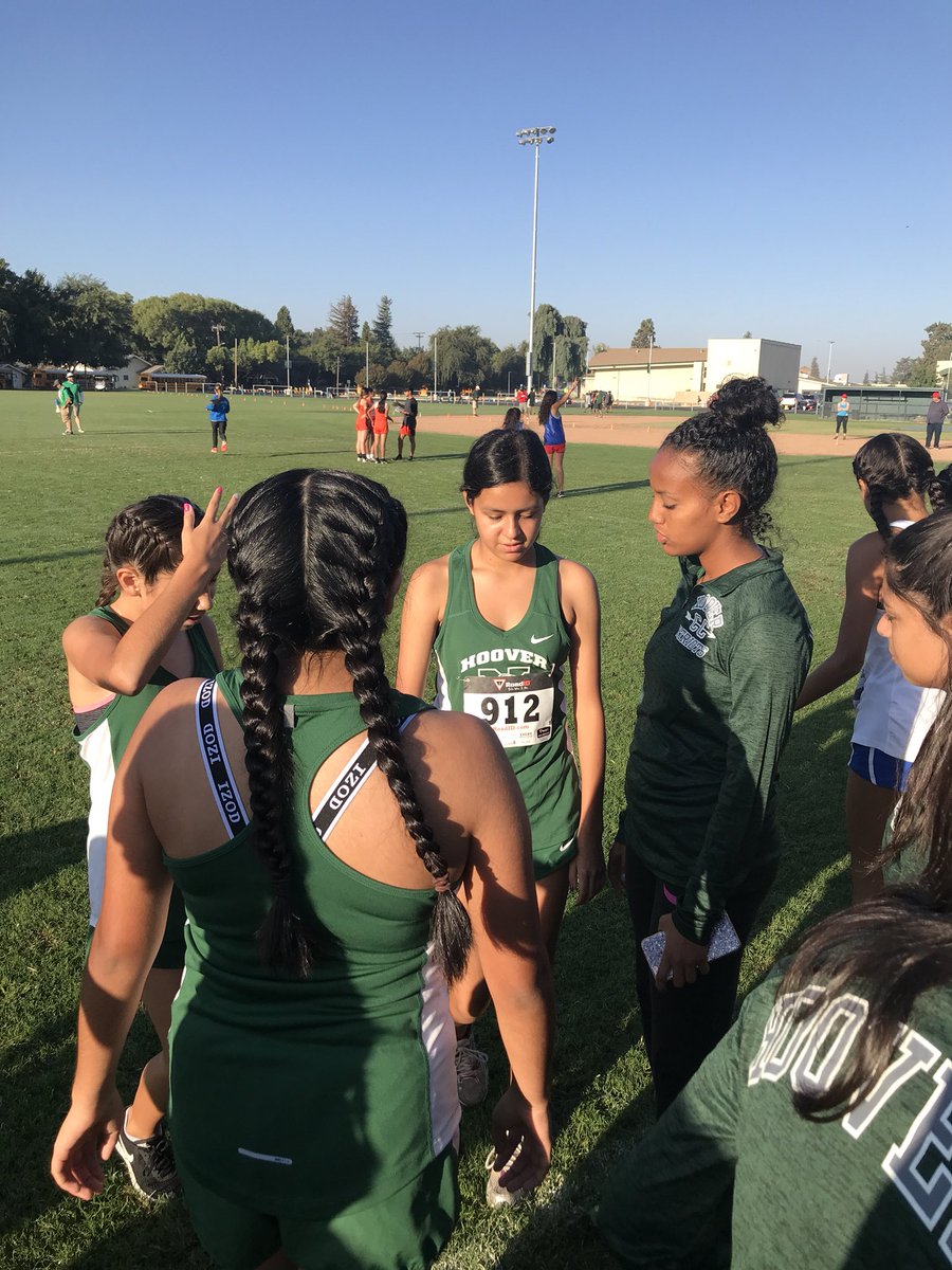 Senior “Coach” Yorkabel giving the Freshman girls advice on their first CC meet. Out here in Kingsburg.