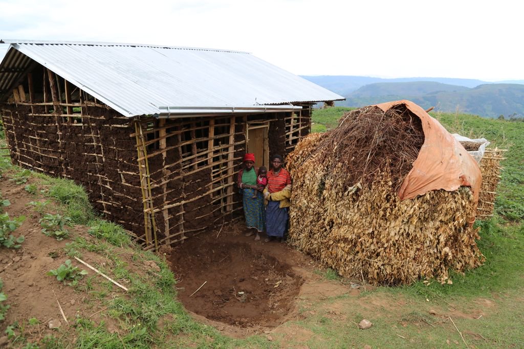 PilotLightFund's tweet photo. These two women lived with their husband in the #Batwa home on the right. #PilotLightFoundation supported the family in building the home on the left. We are glad that the villagers have safe homes and are teaching others how to build as well. #development #Uganda #Africa https://t.co/N4eIAd5c1V