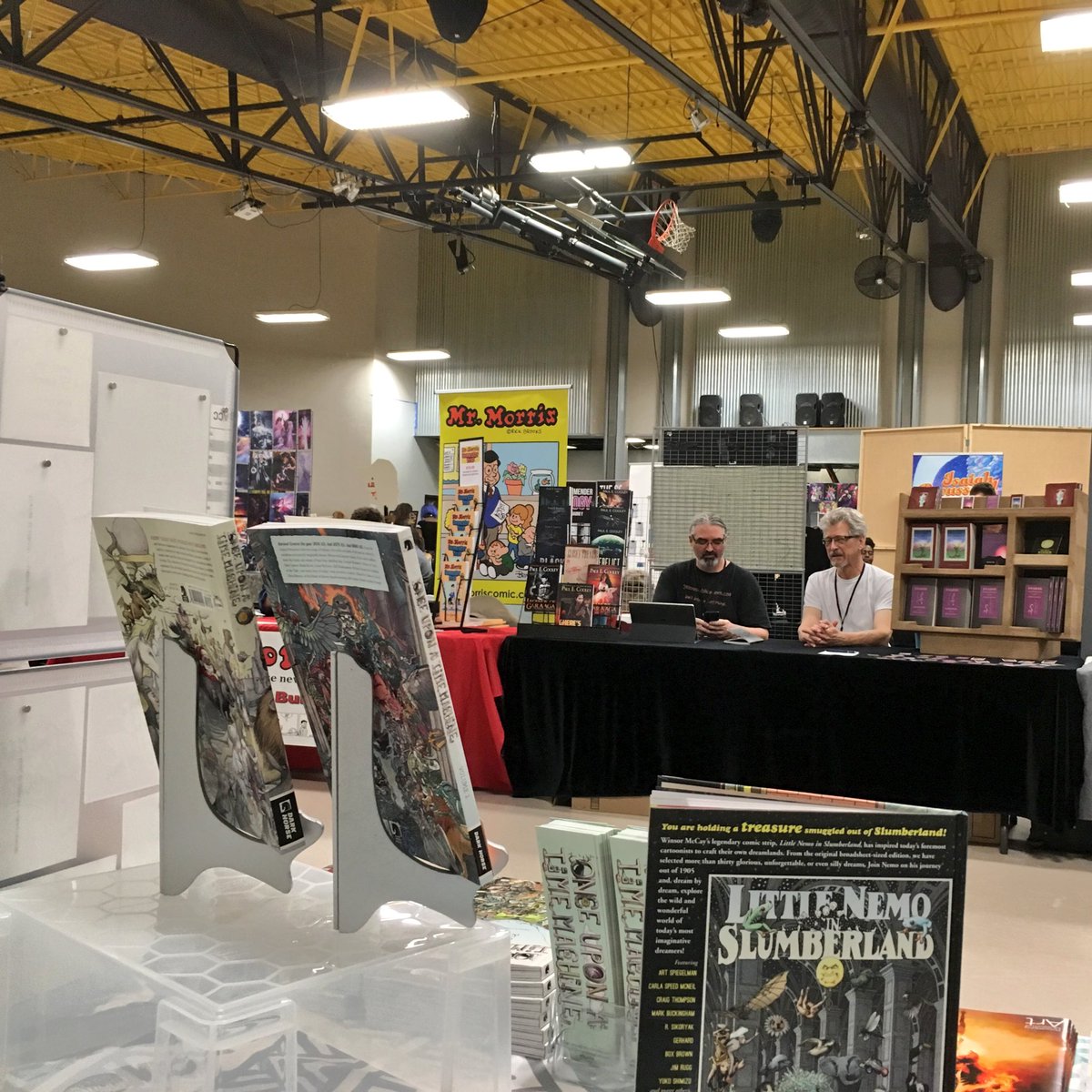 andrewthecarl's tweet photo. View from behind the table at @staple!
Catch me at table #101 to see what happens when science fiction invades Greek mythology (among other comic goodness). #onceuponatimemachine #ouatm #darkhorsecomics #littlenemo #staple2018 https://t.co/yZsQ8xrMbY