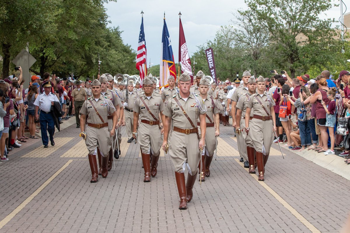 aggie corps marching toward the camera through campus