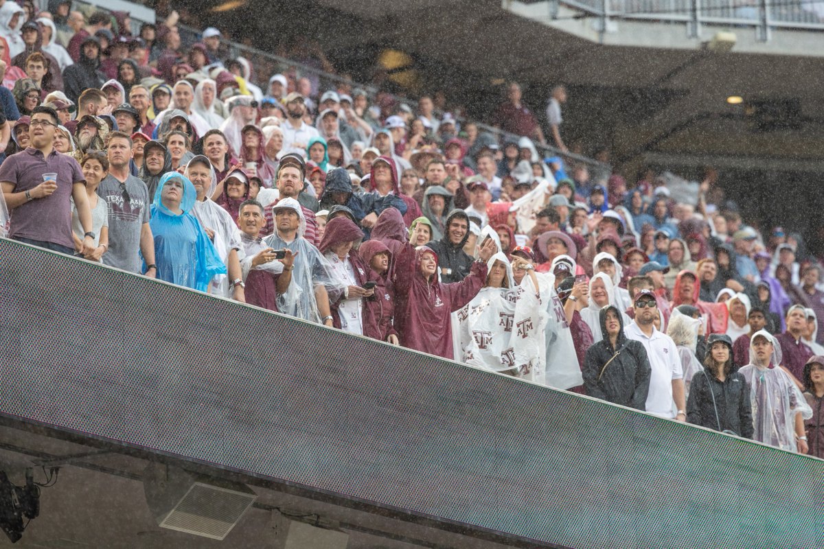 focused on the front few rows of the student section in the rain