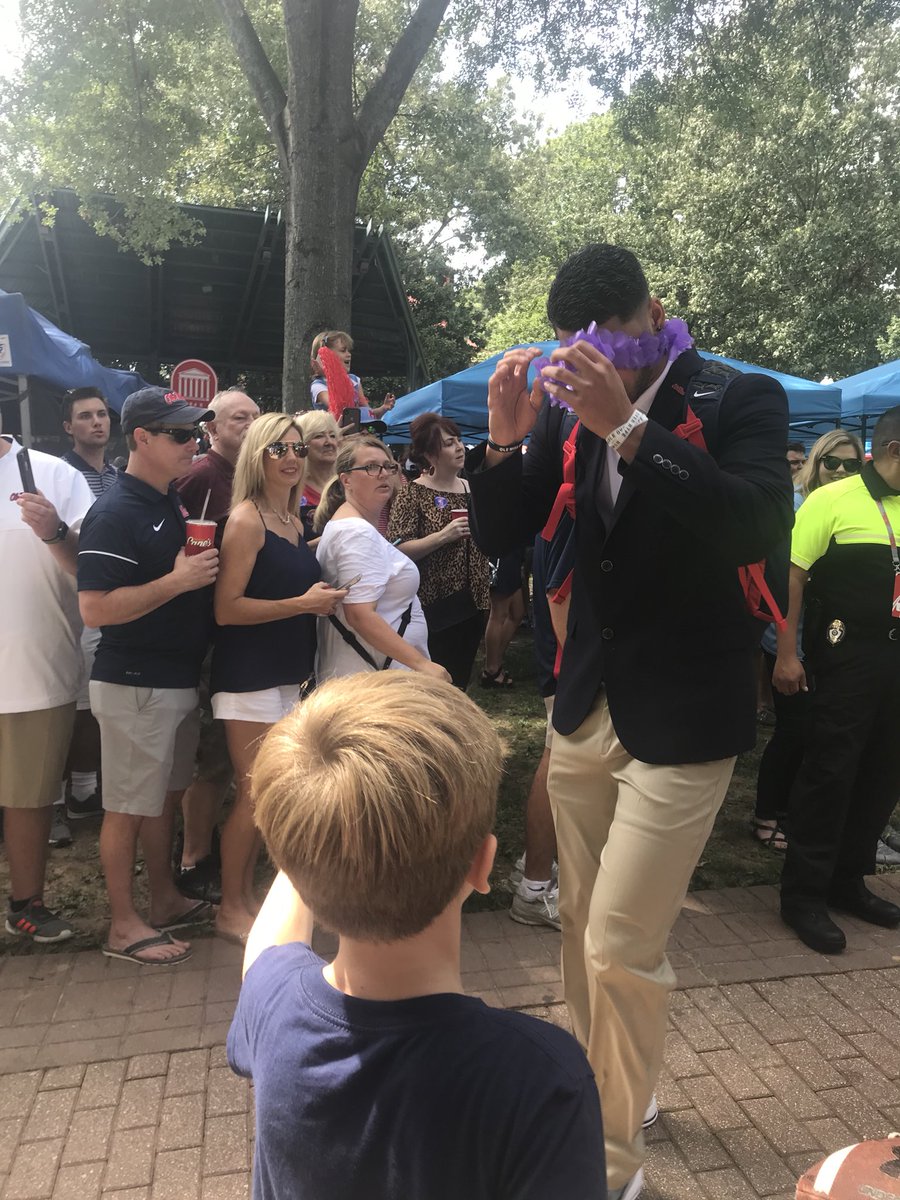 millerbse's tweet photo. A big thank you to @JTaamu10 for making my little boy’s day by giving him your lei during the #walkofchampions today! You have a Rebel fan for life! @OleMissFB #hottytoddy #rebelQB #thegrove https://t.co/PO6f4w0057