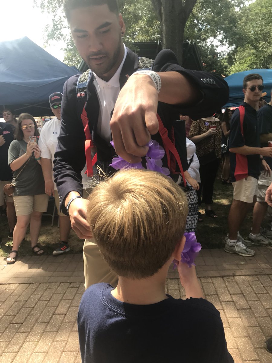 millerbse's tweet photo. A big thank you to @JTaamu10 for making my little boy’s day by giving him your lei during the #walkofchampions today! You have a Rebel fan for life! @OleMissFB #hottytoddy #rebelQB #thegrove https://t.co/PO6f4w0057