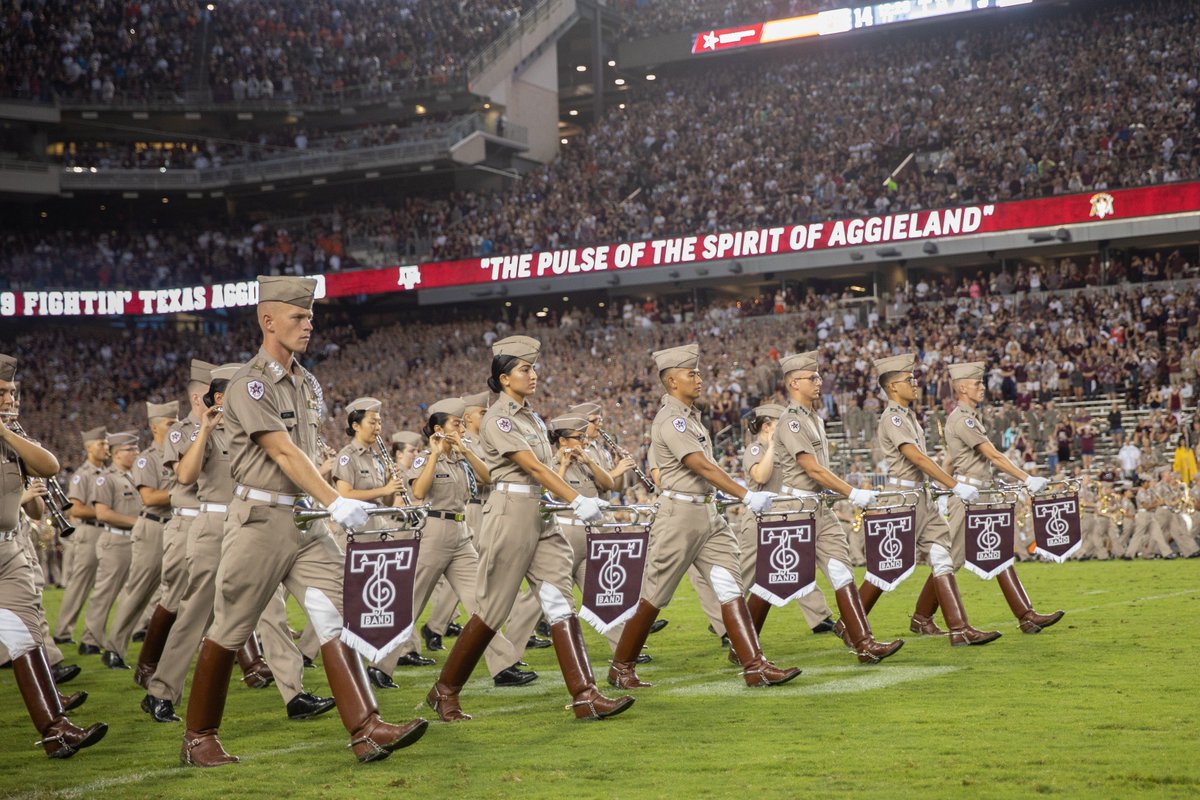 Aggie band members marching on kyle field