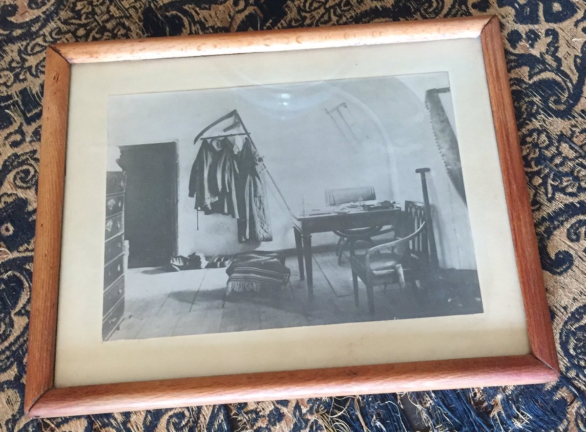 Here's a photo of how the room looked when it was Tolstoy's study. He kept his farming implements to hand, so that he could go straight from writing to labour on his land without the hassle of visiting another room on his way out..