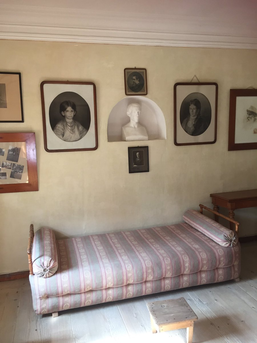 The bed on which Tolstoy was laid out after his body was brought back from Astapovo station, where he died. Thousands came to pay their respects to him here. Here he wrote Anna Karenina. The bust is of his beloved brother Nikolai, whose early death from TB appears in the novel. N
