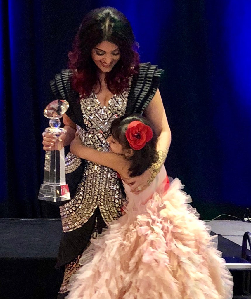 And the Mrs is awarded the Meryl Streep award for excellence at WIFT The little one gives her a congratulatory hug and I look on to the photo a very