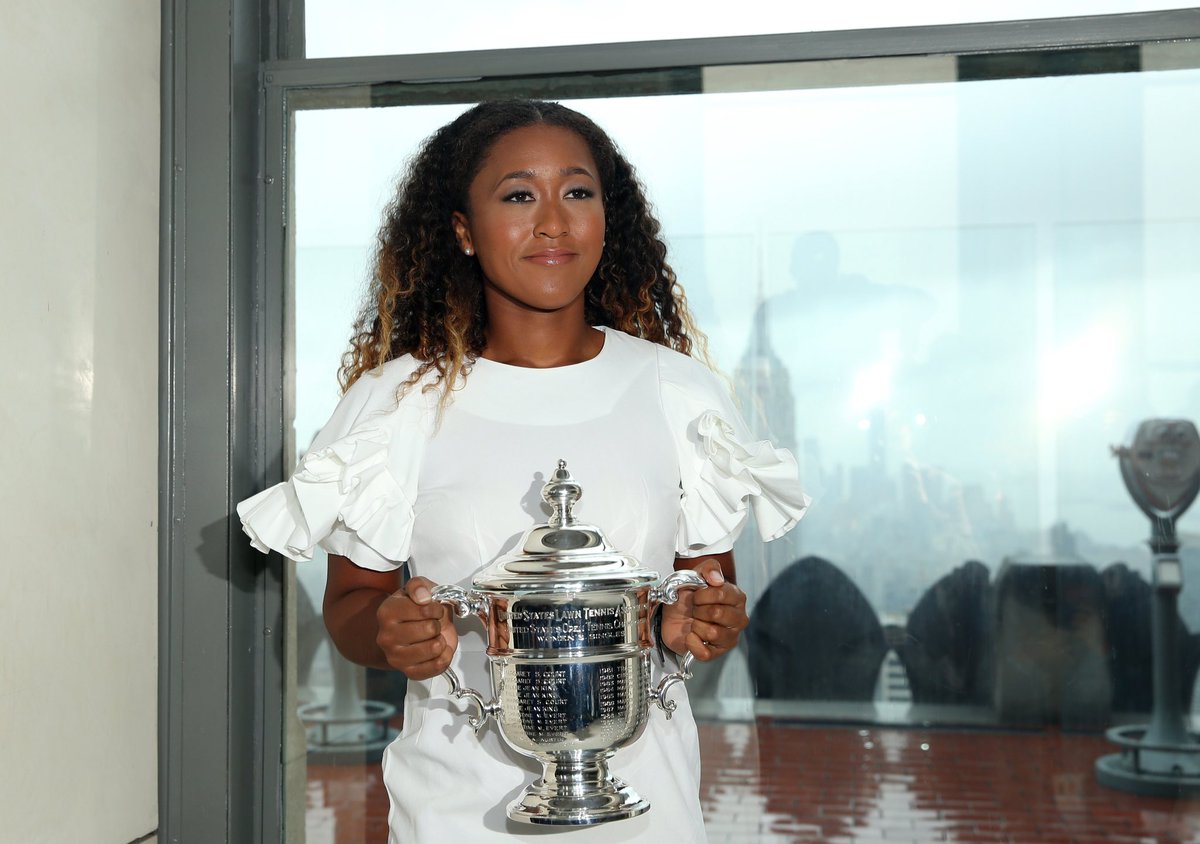 WTA's tweet photo. The rain is keeping us from going outside, but it’s still a beautiful view from inside with @usopen champ @Naomi_Osaka_ at Top of The Rock! 🏆 #大坂なおみ https://t.co/GJNzY21Dvj