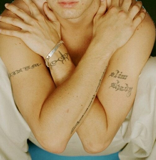 Slim Shady: His violent, pill popping, controversial and explicit alter-ego. This simple tattoo will later turn into a bigger one in memory of his uncle, Ronnie.