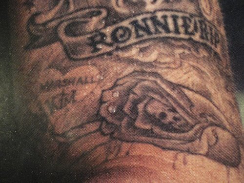 Marshall+Kim: This one is my second favorite tattoo. Below the RONNIE RIP it seems like Marshall added some roses and secrets skulls, plus the M+K. Kim is her ex wife and baby's mother. I found zero info about this tatt. This may be the proof of how deep in love he was with her.