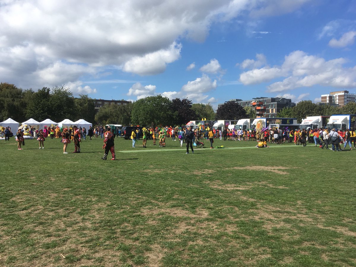 hackneyspeaker's tweet photo. A vibrant treat of rhythm, sequins and community. It seemed like all of #Hackney was out enjoying the celebrations. Performers and the carnival bus seen here getting ready to join the procession #Hackneycarnival2018 https://t.co/kYvZ3Po8db