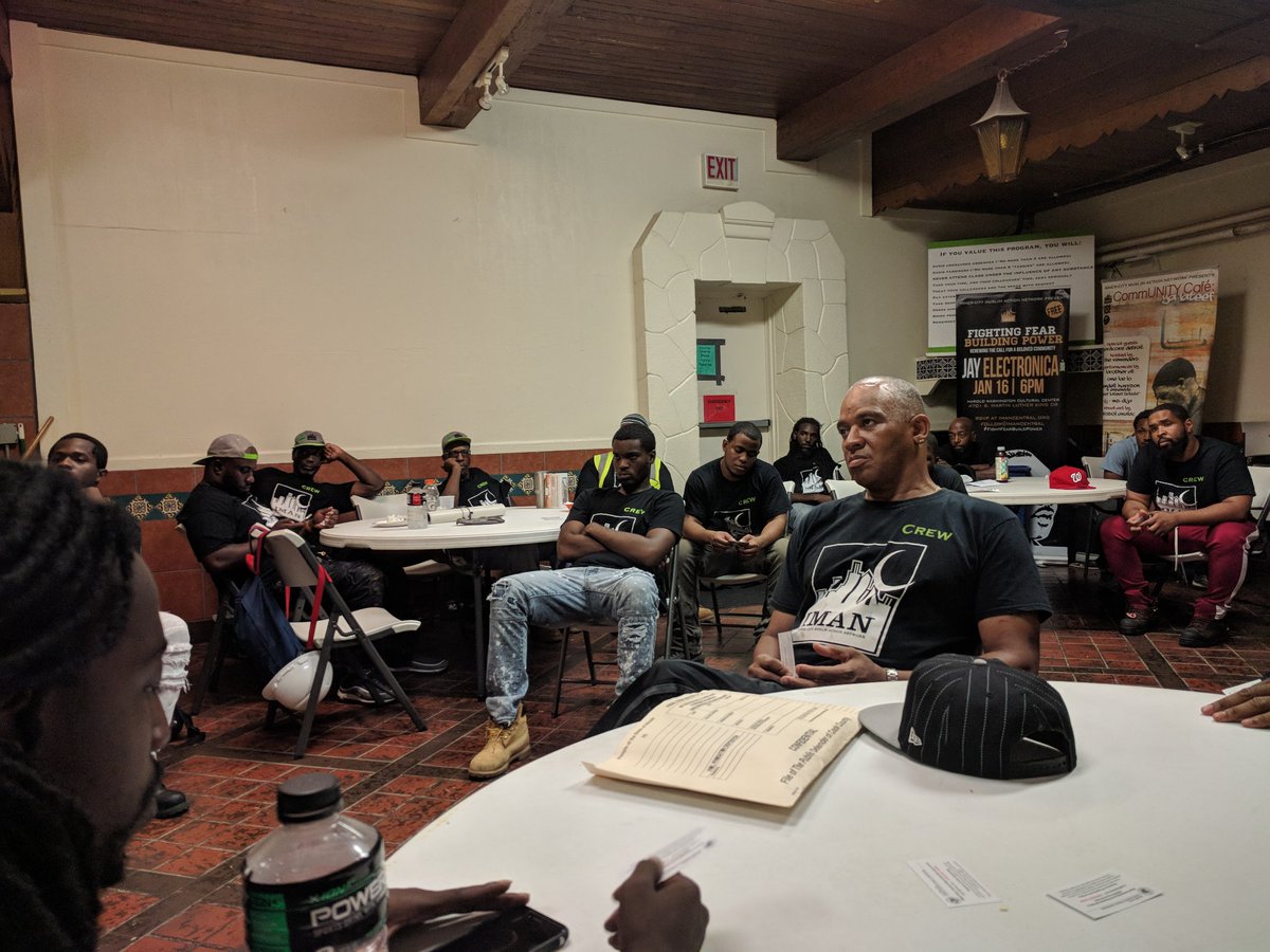 Max from the Office of the Public Defender providing info about the new division and hotline number to call if you are arrested - thank you, IMAN, for hosting!
