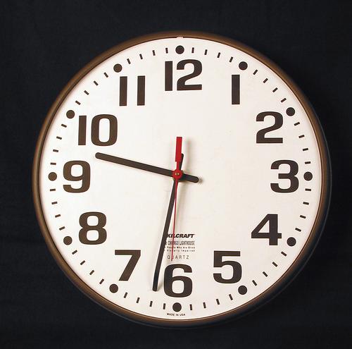 A wall clock at 9:32
