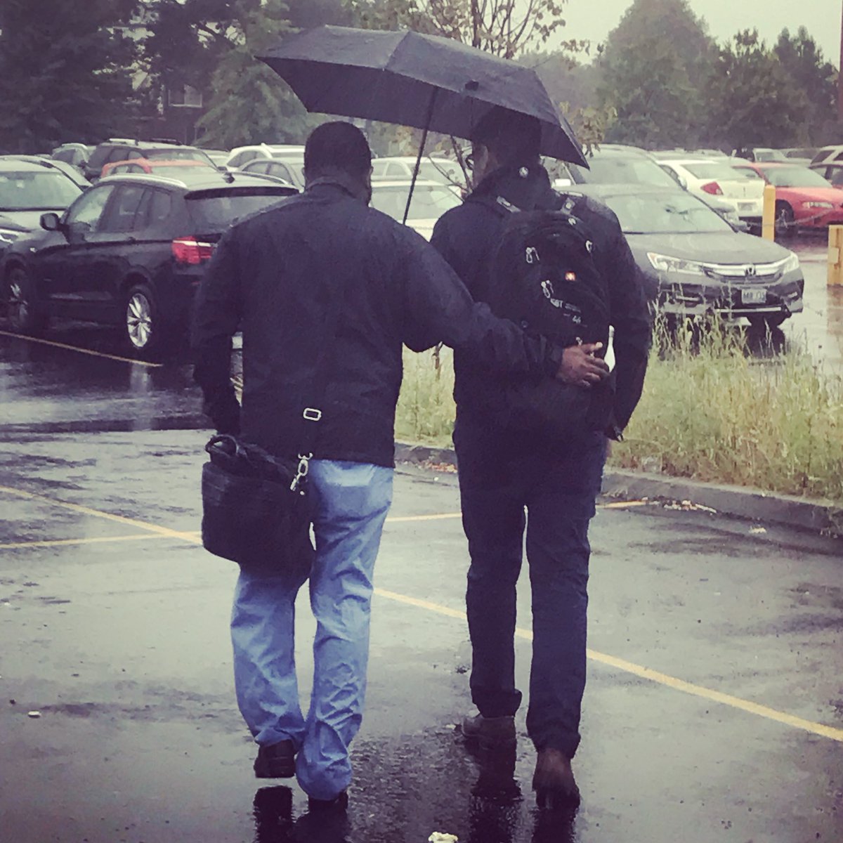 Residents protecting residents on a rainy day in Rhode Island. #candid #residentlove