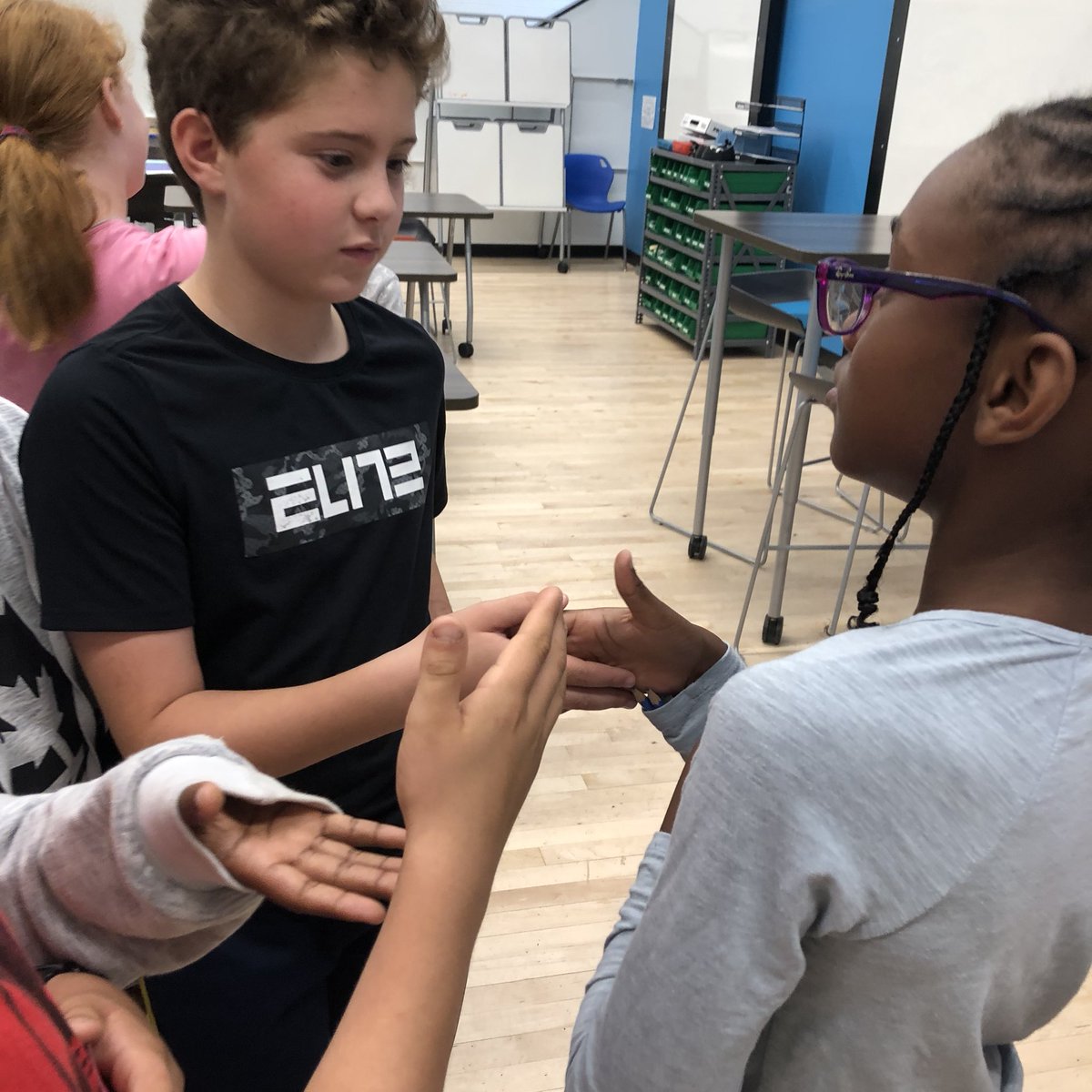 A2STEAMLab's tweet photo. 5th graders started their @PLTWorg Simulation unit by trying a card-based simulation to see how disease spreads. Watch out for the red cards! https://t.co/uHSfSdXGWB