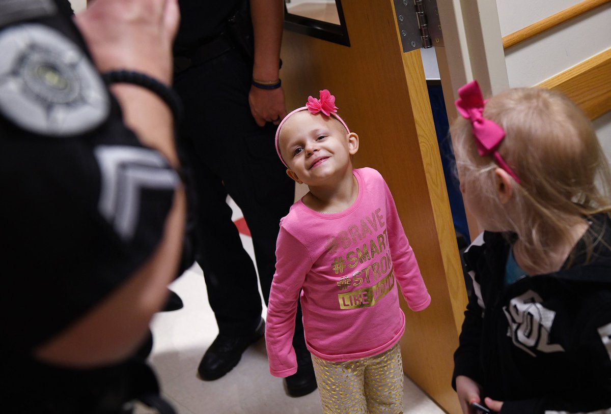 RileyChildrens's tweet photo. Sami Gonzalez, 5, received a special gift today from her new friend, Hammond Police Department Officer Michael Elkman. Elkmann and four other Hammond Ind. P.D. officers escorted Sami and her mother to and from her chemotherapy infusion at Riley Hospital For Children. https://t.co/cn8j4ezXss