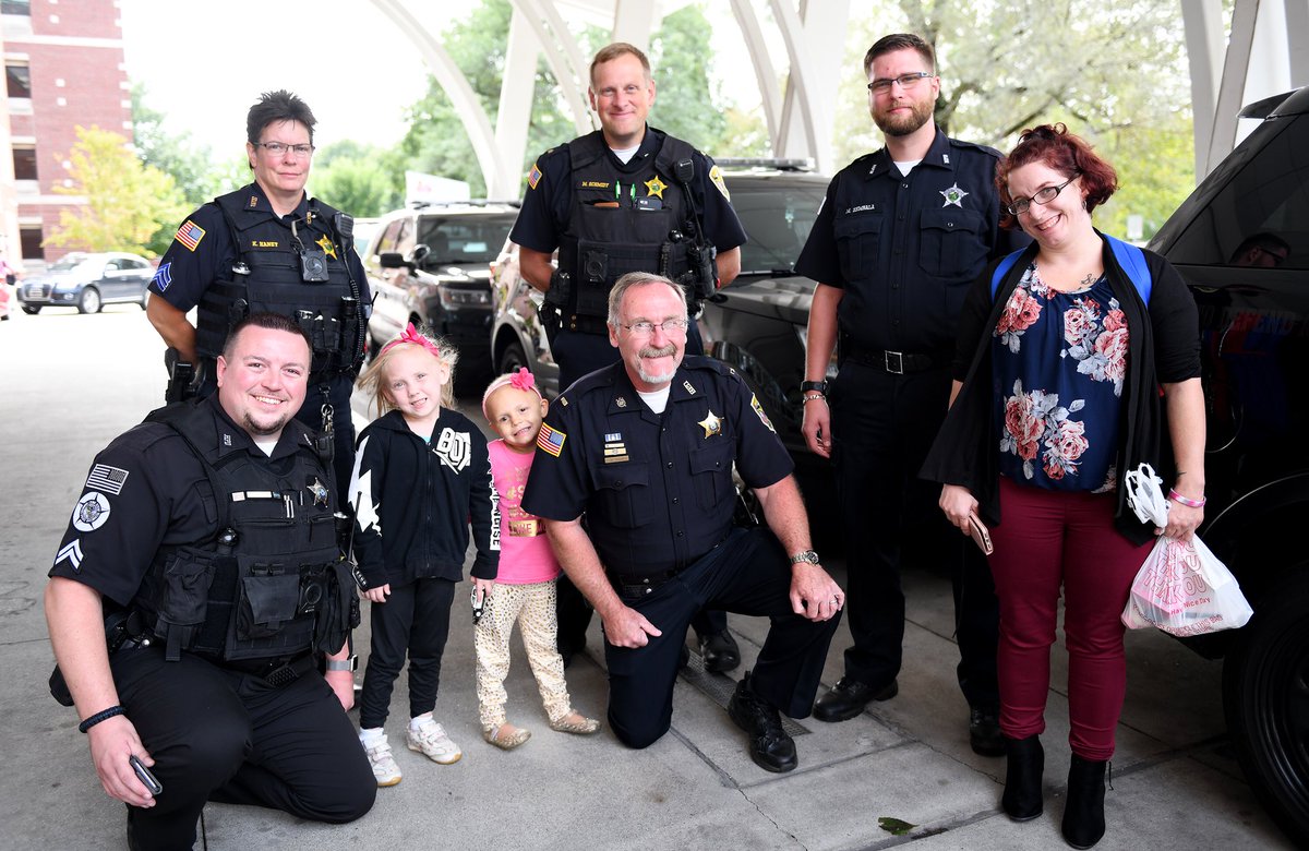 RileyChildrens's tweet photo. Sami Gonzalez, 5, received a special gift today from her new friend, Hammond Police Department Officer Michael Elkman. Elkmann and four other Hammond Ind. P.D. officers escorted Sami and her mother to and from her chemotherapy infusion at Riley Hospital For Children. https://t.co/cn8j4ezXss