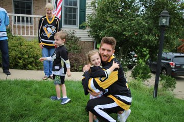 Young Penguins fan runs to give Matt Murray a hug.