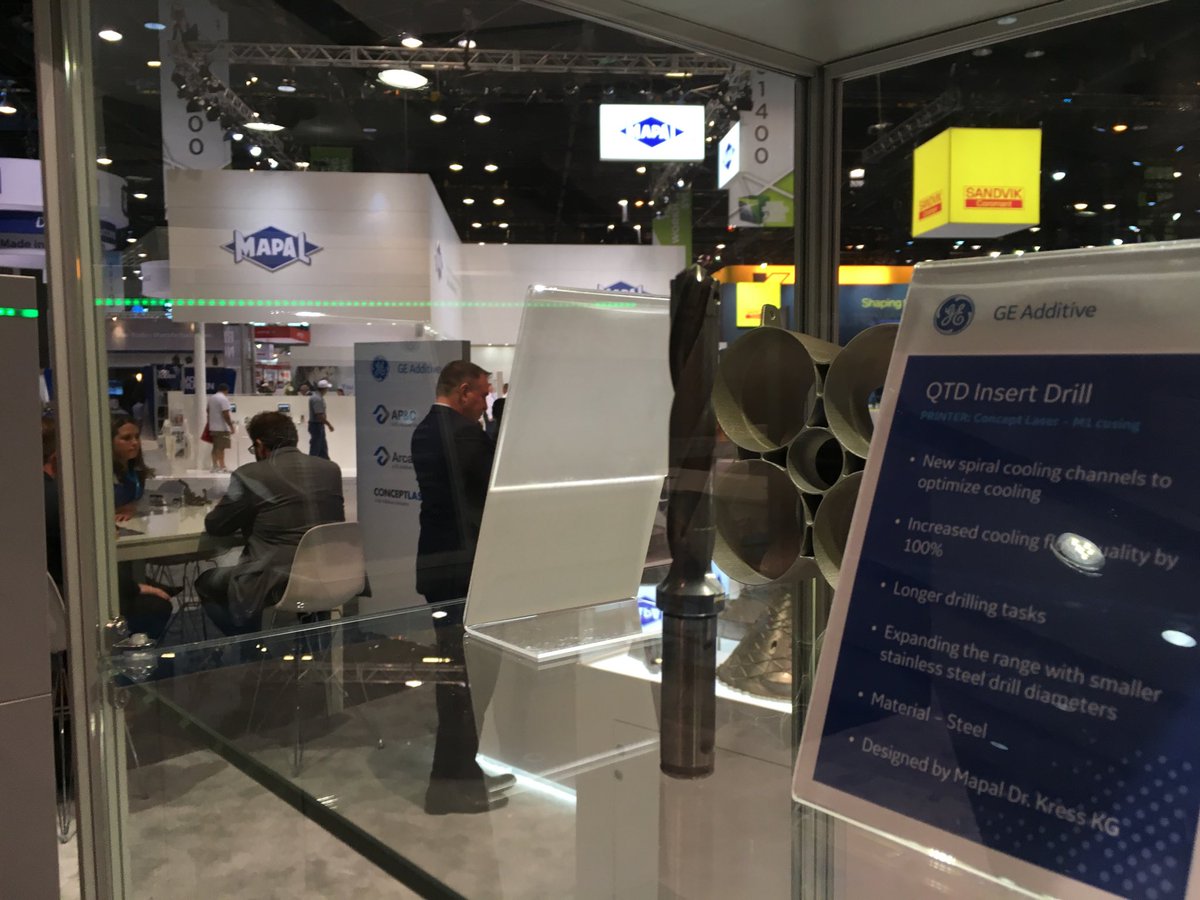 AMPeterZelinski's tweet image. .@GEAdditive displaying 3D printed drill with internal, spiraling coolant channels, designed by Mapal. As the luck of #IMTS booth positioning would have it, Mapal is visible in the background. #PrinttheFuture