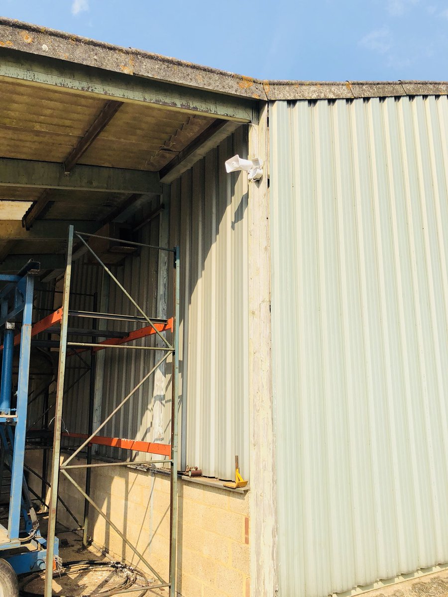 Hikvison 360 mini dome with speaker and red wall installed on a customers site