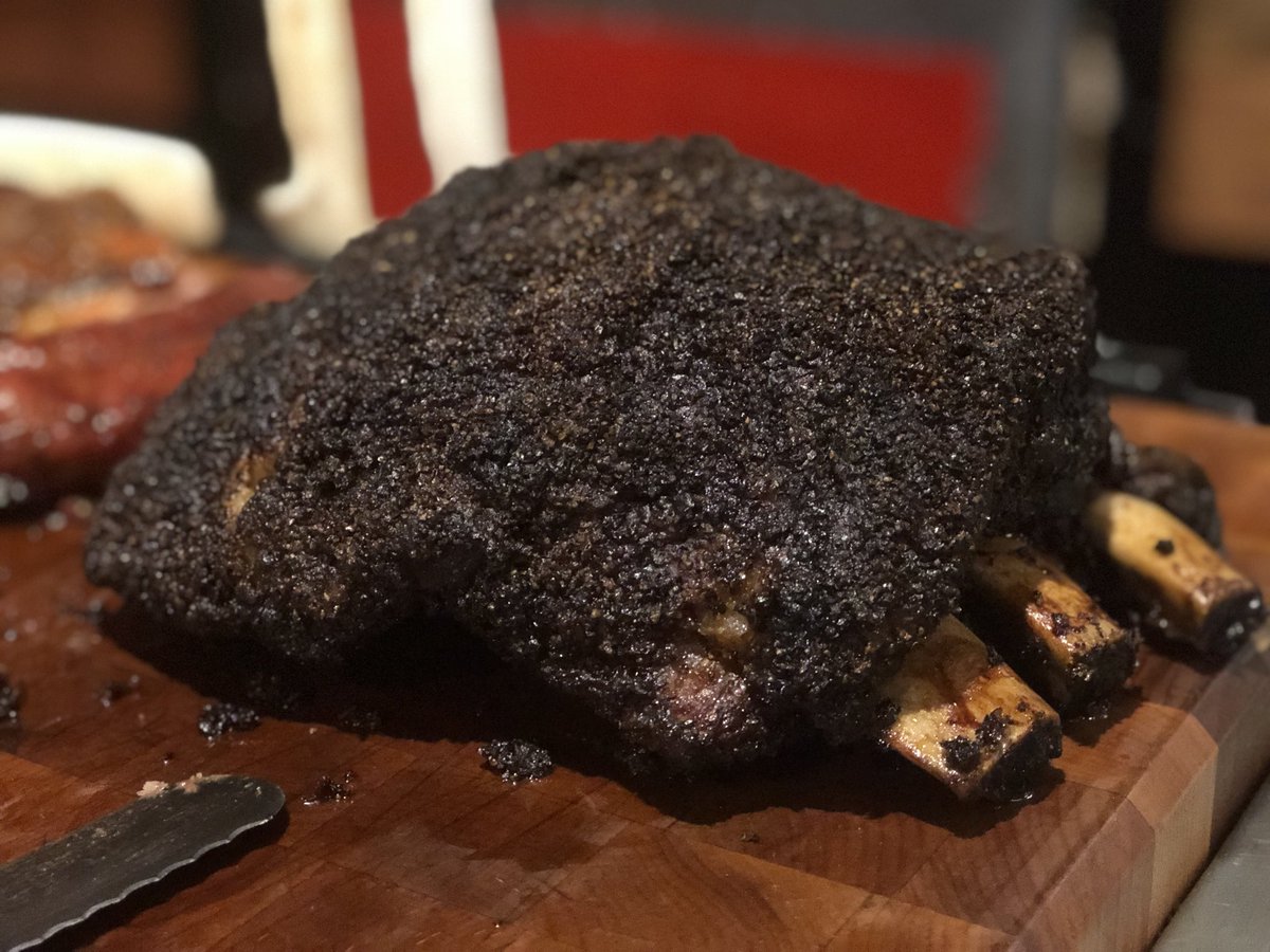 texastufton's tweet photo. I haven’t tweeted in a while, but sharing this big, juicy hunk of meat with @rtufton from @blacksbbqaustin left me so inclined. Beef rib, always the right choice. #beef #beefrib #bark #fellrightoffthatbone https://t.co/tU8EXPD92c