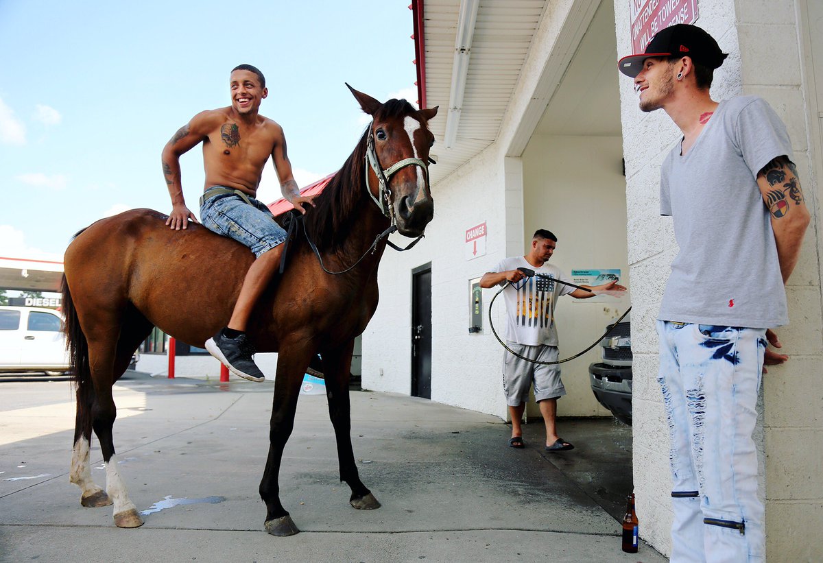 Oh North Carolina 💕🐴....        Ridge Clark, 23, rode his horse Moneylicious, bareback, six miles to the car wash to hang out with his friends, in rural Pembroke, North Carolina, Sunday, September 23, 2018.