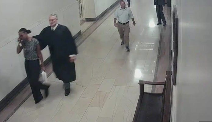Black woman files for a protection order. White judge denies it. She gets upset & leaves. Judge chases her, grabs her by the neck, drags her back to the court, jails her for 3 days. 
Black Judge overrules him, releases the woman. 
White judge rage quits.

 buff.ly/2QZkAjU