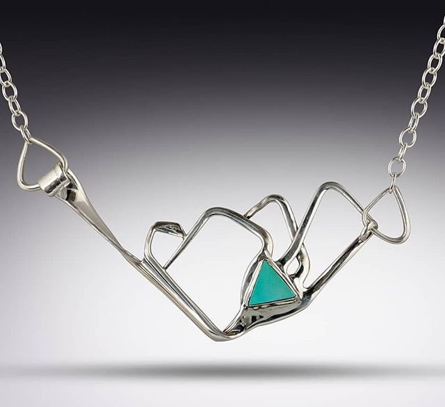 Available now: our award winning Mountain Range Necklace, made from a vintage sterling silver flatware dinner fork, with extra fork tines and a triangular turquoise stone. 
#mountains #mountainrange #mountainart #silverwarejewelry #turquoise #turquoiseje… ift.tt/2IbJ7OF